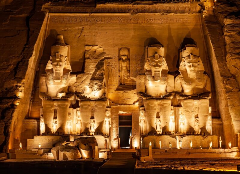 Statue of Pharaoh Ramses II in front of The Great Temple of Ramses II in Abu Simbel in the night, Aswan, Upper Egypt.