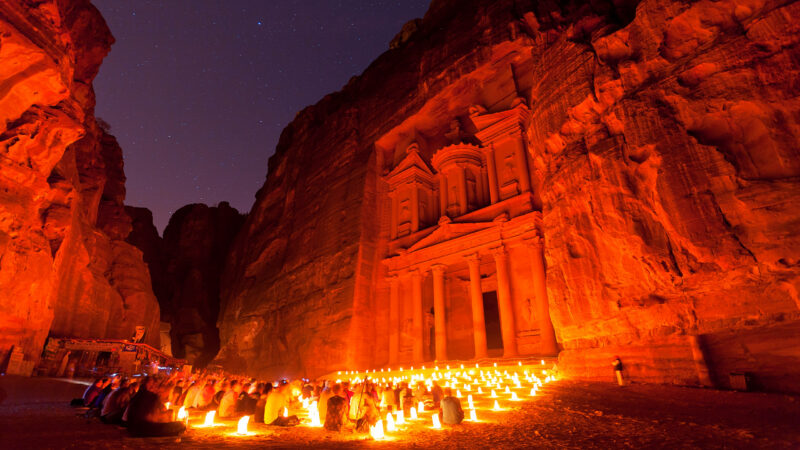 Hundreds of candles illuminate the Treasury forecourt during Petra by Night in Jordan.