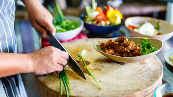 Chef making traditional cambodian meat dish at cooking class