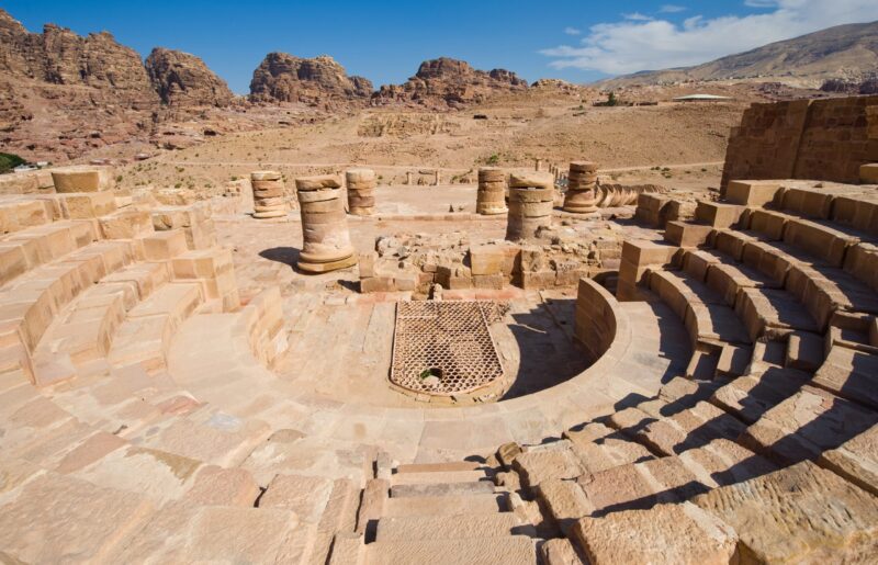 Stone seating steps sweep around the excavated odeon inside the Great Temple complex of Petra, Jordan.