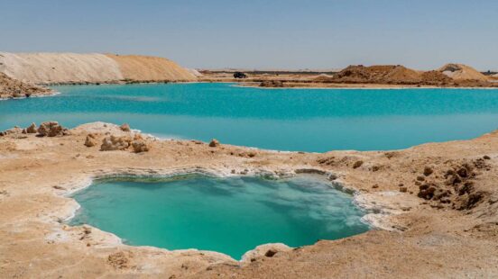 Luxury Egypt Tours - Bright blue natural pools in rocky landscape