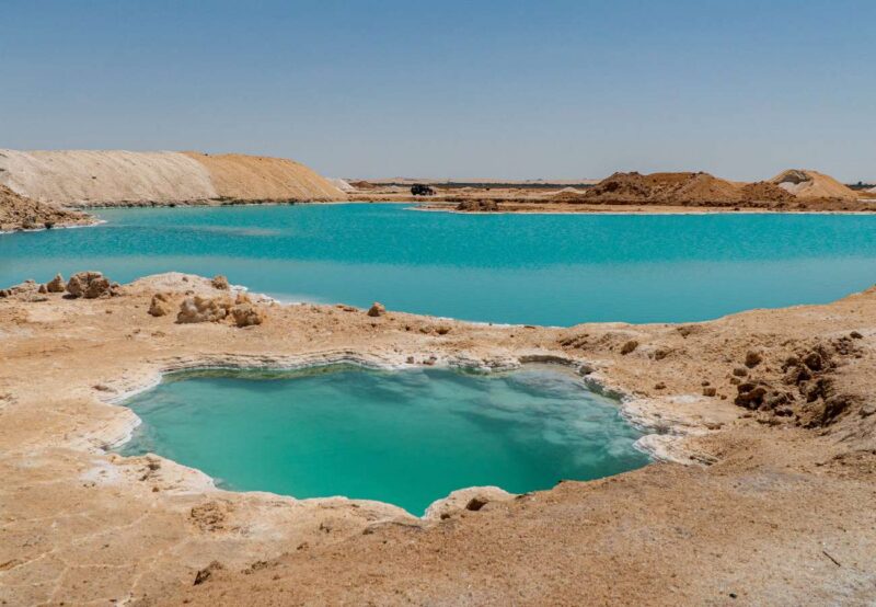 Luxury Egypt Tours - Bright blue natural pools in rocky landscape