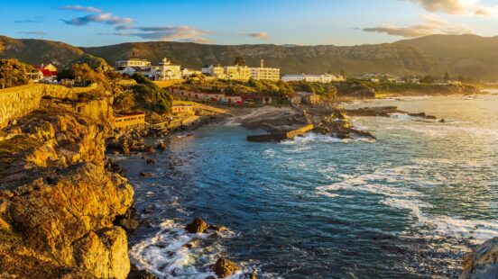 Early morning coastal view from Gearing’s Point of the rocky Hermanus coastline and Old Harbour.