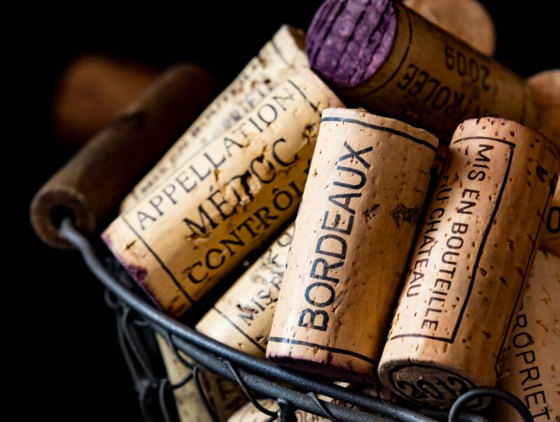 old cork stoppers of French wines in a wire basket