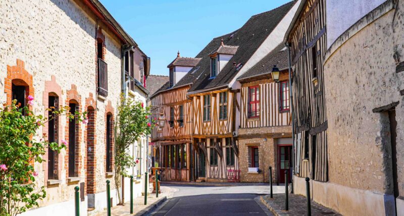Half-timbered houses in the main shopping street of the popular medieval town of Provins in Seine et Marne, Paris region, France