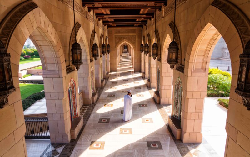 MUSCAT, OMAN – NOV 22, 2018: Sultan Qaboos Grand Mosque. Grand mosque In Muscat. The Muscat mosque is the main active mosque of Muscat, Sultanate of Oman muscat,oman,mosque,grand,qaboos,sultan,building,garden,landscape,skyline,islam,omani,courtyard,minaret,religion,landmark,exterior,tourism,tower,allah,arab,architecture,belief,crescent,culture,design,dome,holy,ibadi,islamic,journey,modern,muslim,pray,quran,sacred,sight,sky,spiritual,square,stone,structure,sunni,sunny,tourist,traditional,travel,trip,asia,middle east