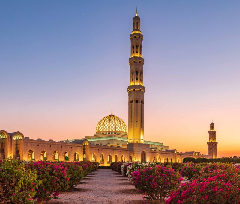 AS27 EWI0123 Architecture, Bawshar, Blue, Colorful, Danita Delimont, Dome, Dusk, Emily Wilson, Evening, Exterior, Formal Garden, Garden, Islam, Middle East, Minaret, Mosque, Muscat, Muslim, Nobody, Oman, Outdoor, Pink, RF, Sultan Qaboos Grand Mosque, Sunset, Tower Middle East, Arabian Peninsula, Oman, Muscat. Sunset view of the Sultan Qaboos Grand Mosque in Bawshar.