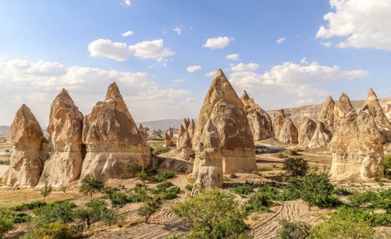 Tall, conical rock formations known as fairy chimneys viewed on luxury Turkey Asia holidays.