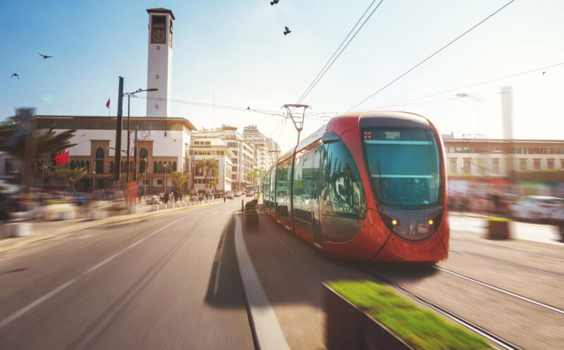 a tram passing near a landmark in Casablanca, Morocco