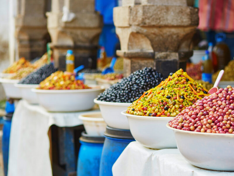 Selection of pickled olives on a traditional Moroccan market (souk) in Essaouira, Morocco