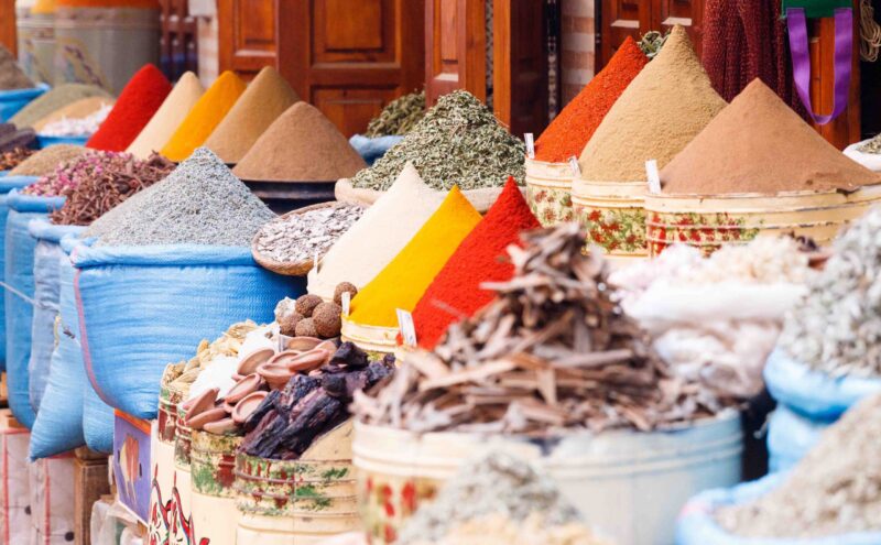 Colorful cooking Spices and flower in traditional local medina bazaar market in Marrakesh, Morocco