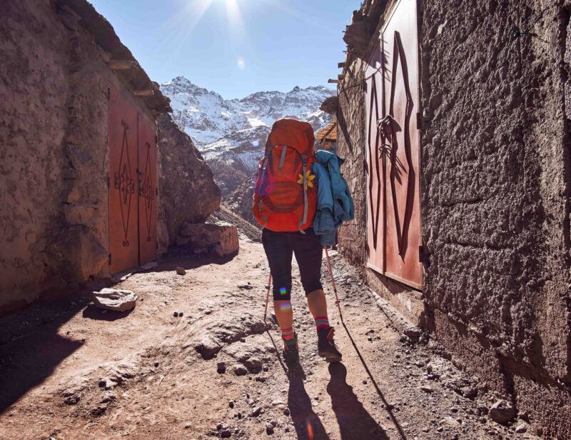 Tourist girl backpacker on the hike into the Atlas mountains in Morocco Africa