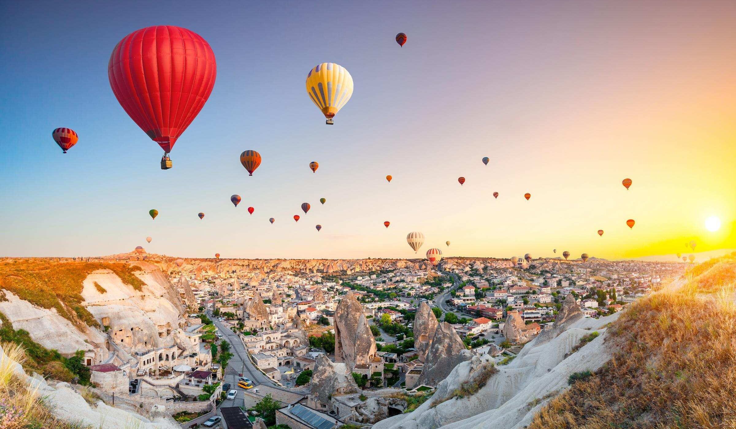 Hot air balloons flying over spectacular Cappadocia
