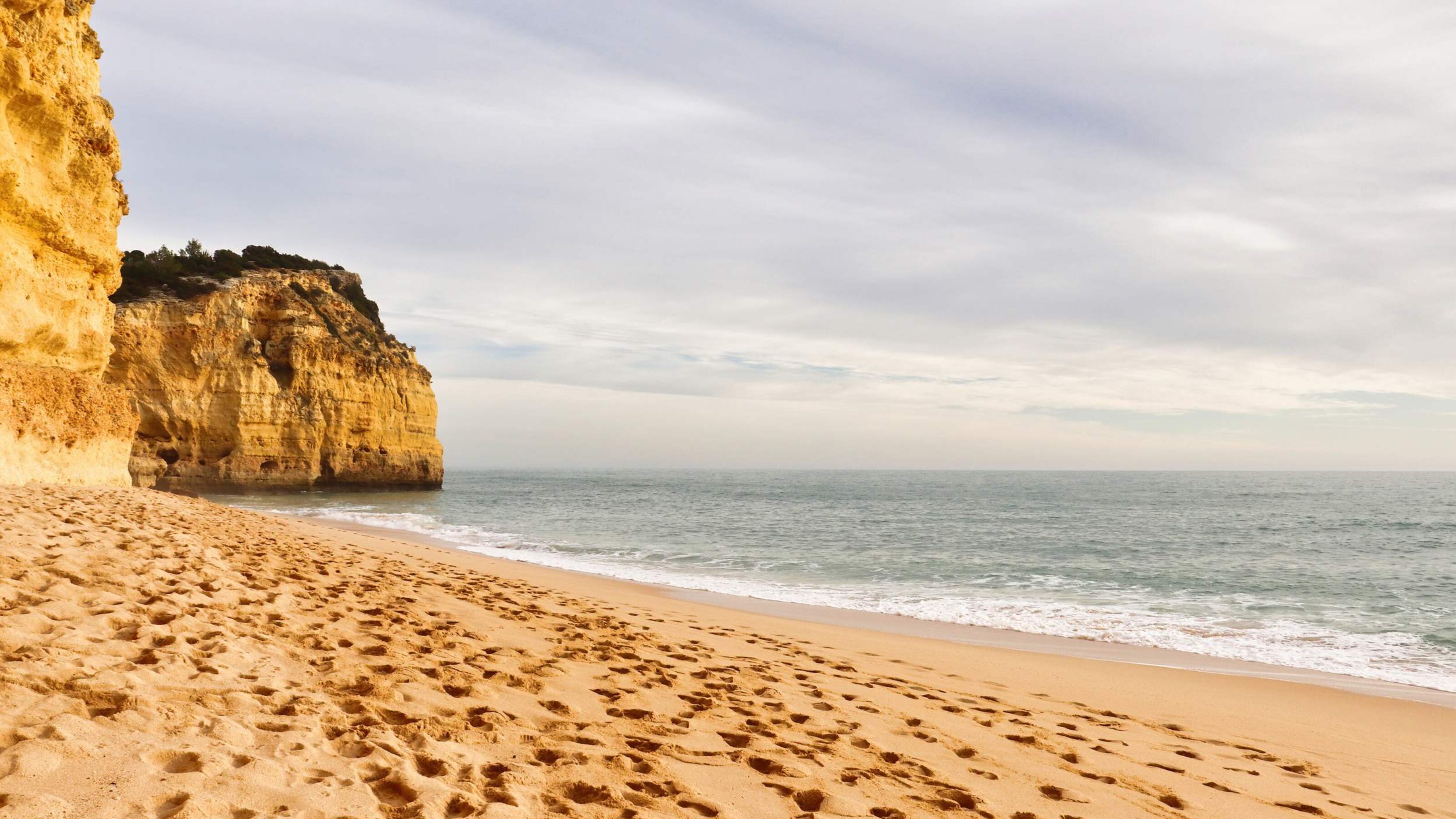 Footprints in the sand on a beach in southern Portugal