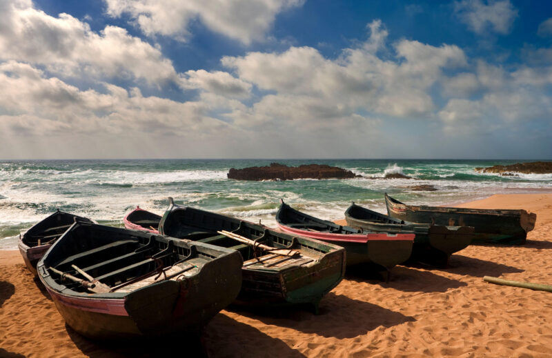 Morocco. Oualidia. Atlantic Coast and fish boats on the beach
