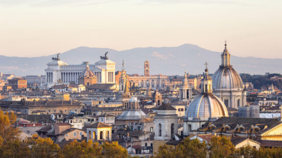 Roman cityscape panorama at sunset, Rome Italy