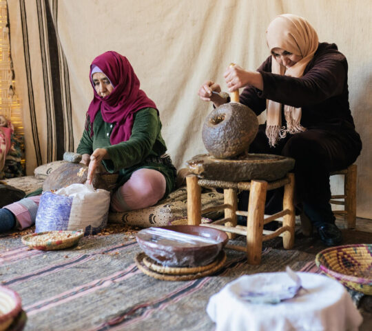 Women extracting argan nut oil