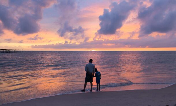 Father and son at Alleppey Alappuzha Beach Kerala India