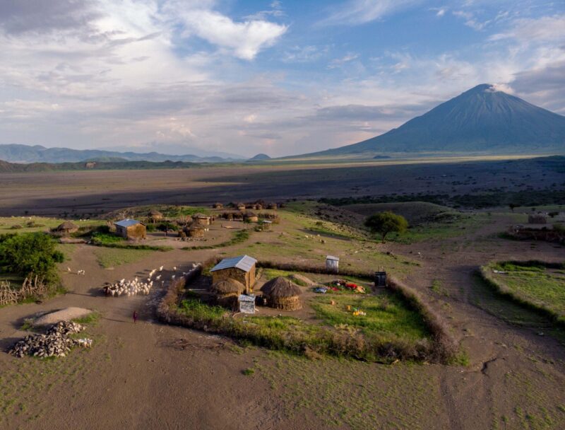 Aerial Drone Shot. Traditional Masai village at Sunset time near Arusha, Tanzania.