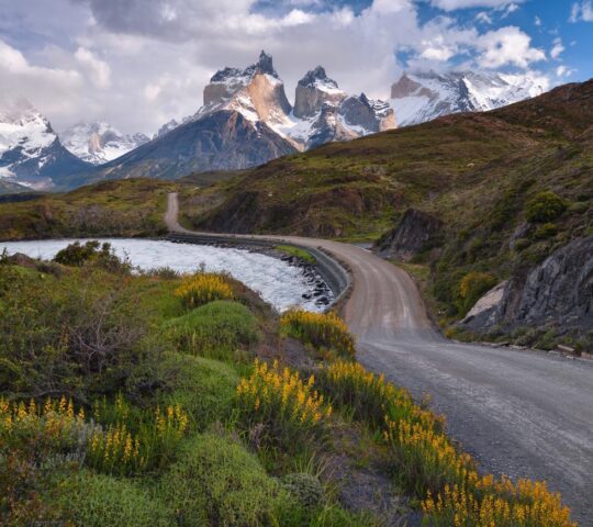 A winding road, hugging a lake in Torres del Paine National Park