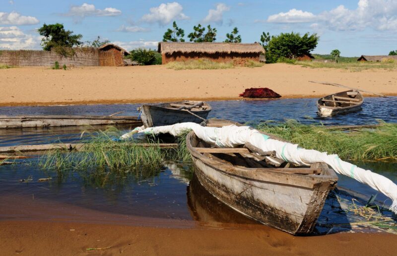 Tanganyika lake is the Worlds longest and second deepest fresh water lake, it is also one of the oldest lakes on the planet. The picture presents beautiful sand beach, Tanzania