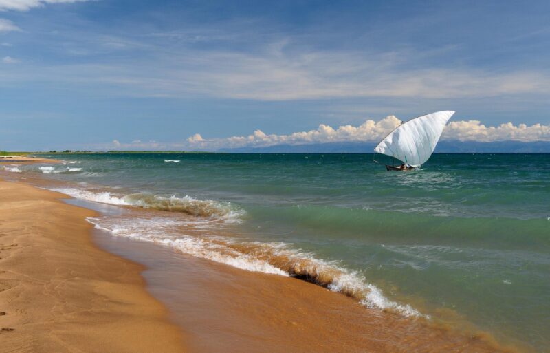 Tanganyika lake is the Worlds longest and second deepest fresh water lake, it is also one of the oldest lakes on the planet. The picture presents beautiful sand beach, Tanzania