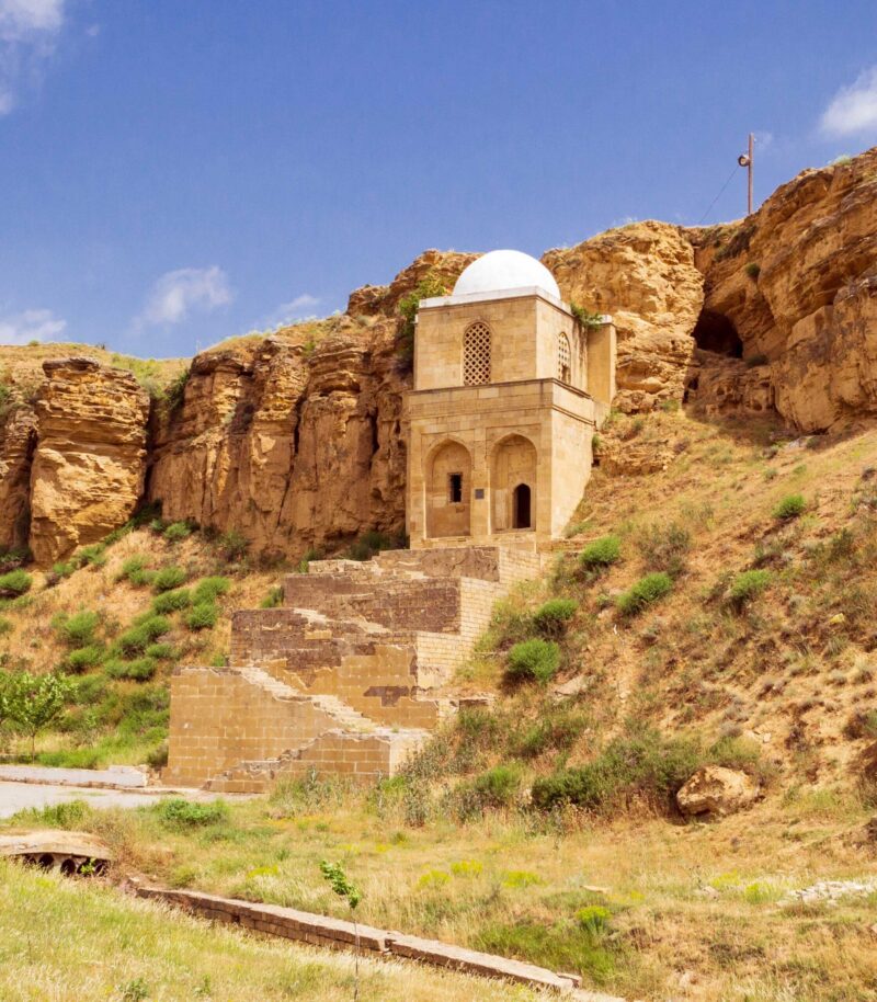 Diri Baba Mausoleum carved directly into a sheer sandstone cliff face in Maraza, Azerbaijan.