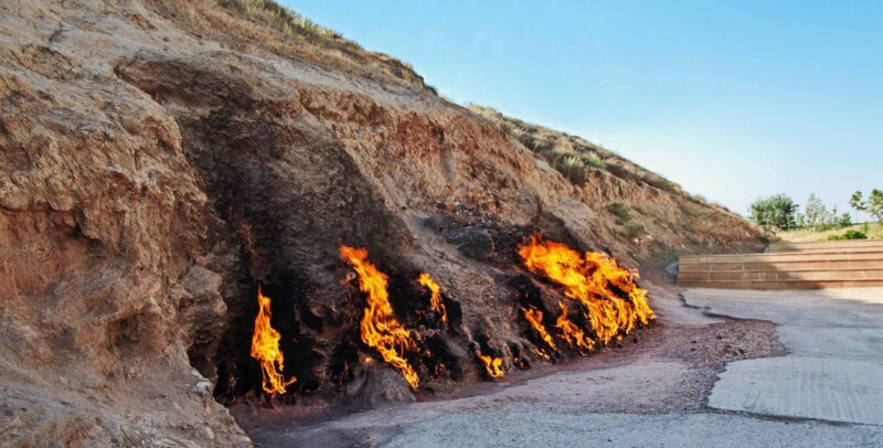 Natural gas fires burn continuously along a sandstone hillside at Yanar Dag in Azerbaijan.