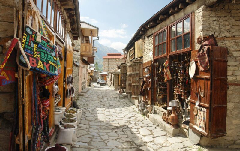 Craft workshops and copperware line the cobbled stone streets of Lahic village, Azerbaijan.