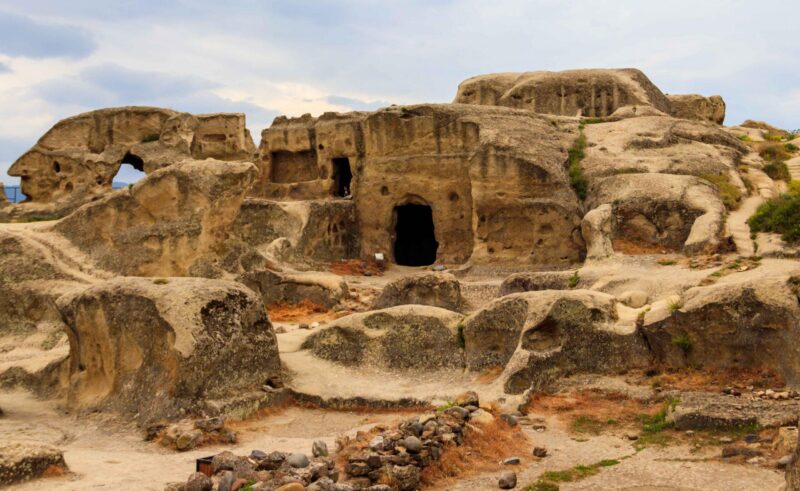 Ancient cave dwellings and rock-cut structures form the ancient city of Uplistsikhe in Georgia.