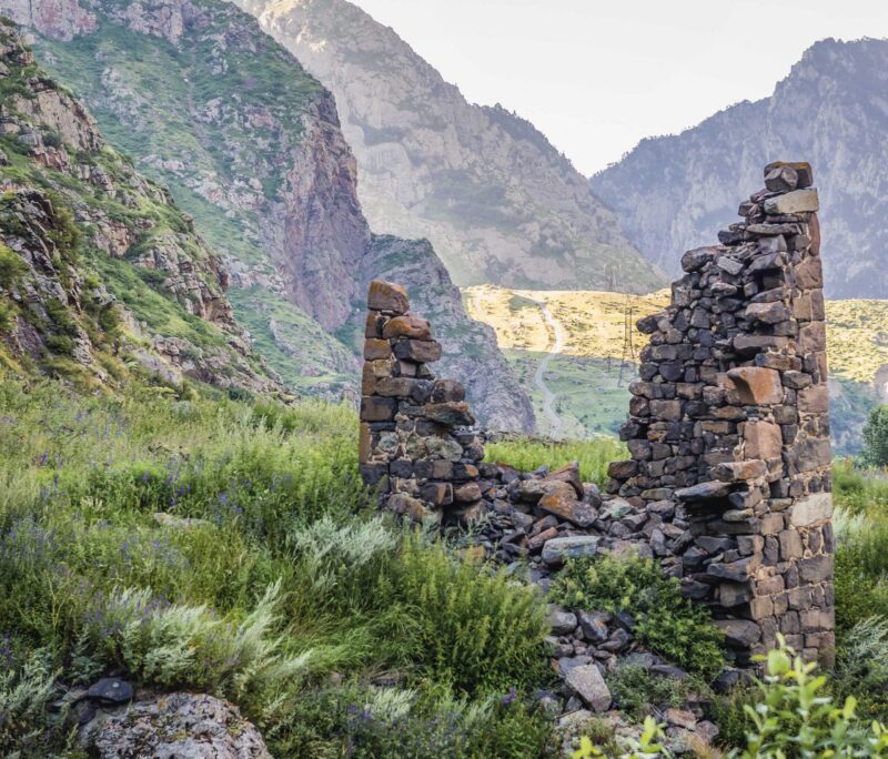 Ruins on trail to Gveleti Waterfall in Dariali Gorge in Kazbegi National Park, Georgia