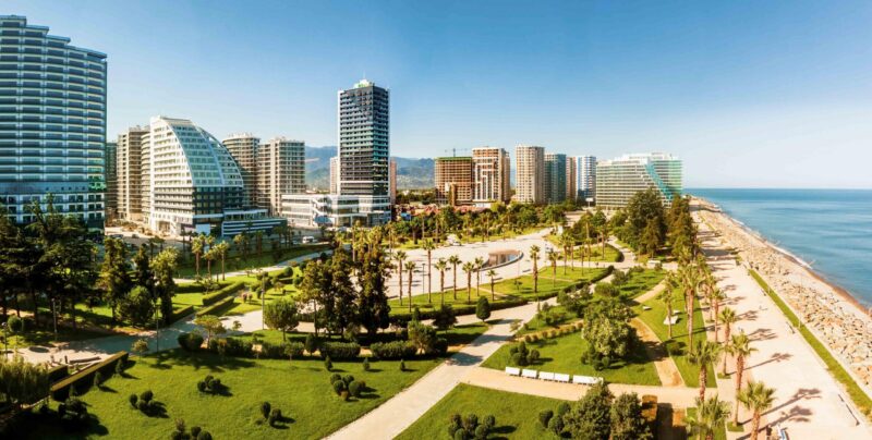Panoramic View Batumi coast and hotel buildings with black sea background. Vacation holidays in caucasus. Georgian vegas