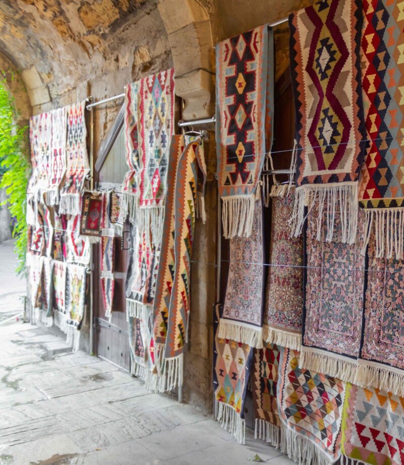 Ancient oriental handmade carpets at Old Town Baku streets. Baku Azerbaijan.