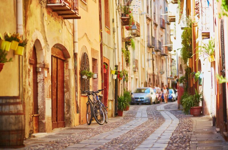 Typical colorful Italian houses on a street of Bosa, Sardinia, Italy