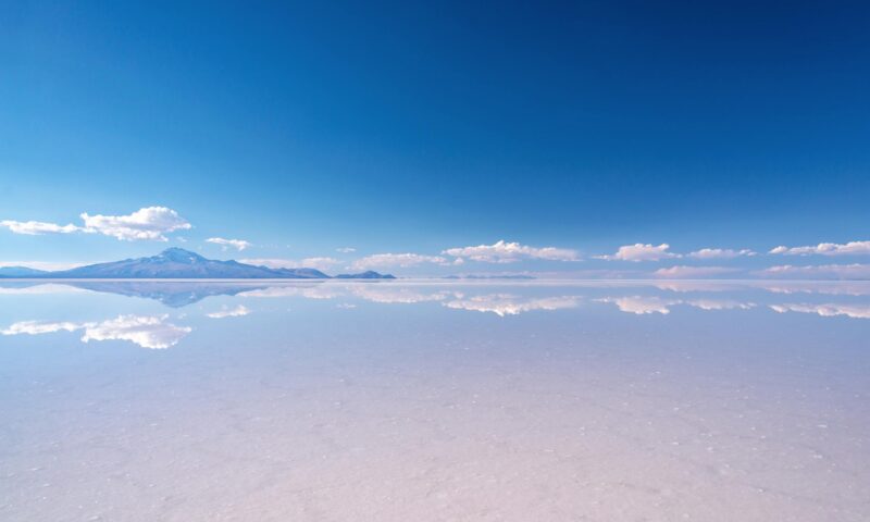 uyuni, salar, salt flat, mirror, effect, reflections, salar de uyuni, travel, adventure, tourism, salt, water, flooded, lake, bolivia, potosi, altiplano, landscape, space, view, nature, destination, attraction, landmark, scene, scenery, scenic, andes, andean, natural, bolivian, south america, freedom, south american, panorama, potosi, province, copy-space, copyspace, copy space, unesco, world heritage, site, desert, famous, journey, abstract, symmetry, symmetric, mountain Miror effect and reflection of mountain in Salar de Uyuni (Uyuni salt flats), Potosi, Bolivia, South America