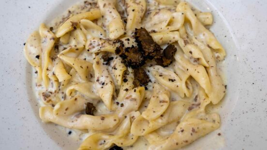 fuzi istrian pasta with black truffle tartufo mashroom and cream traditional food in Rovinj Croatia