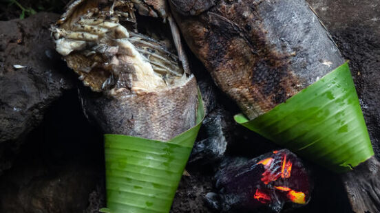 Easter Island food. Local fish prepared on hot stones.