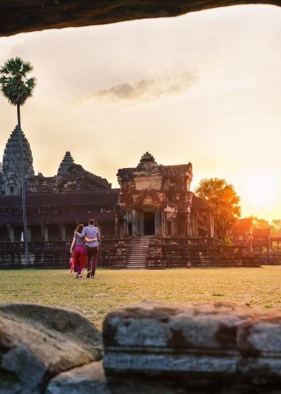 A couple in Angkor Wat at sunrise moment, Siem Reap, Cambodia