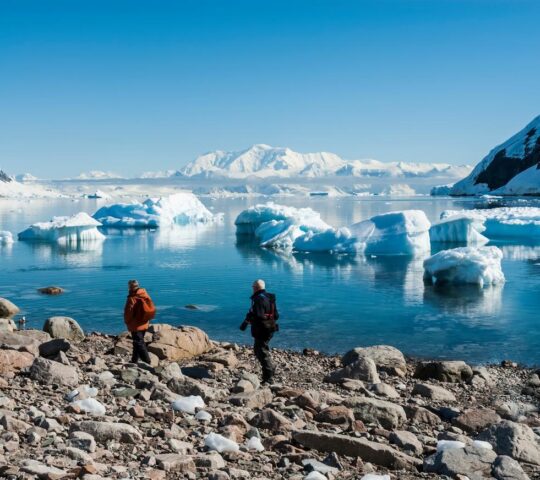 Travellers explore Neko Bay on foot