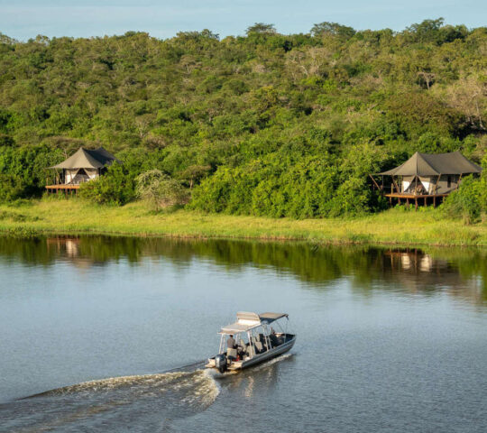 A boat delivers guests to Wilderness Magashi Camp in Akagera National Park