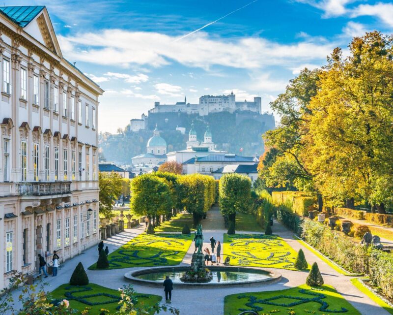 Beautiful view of famous Mirabell Gardens with the old historic Fortress Hohensalzburg in the background in Salzburg, Austria 488873472 Ornamental Garden, European Culture, Tourism, Hohensalzburg Fortress, Grass, Flowerbed, Austrian Culture, Scenics, Medieval, History, Old, Cultures, Famous Place, Architecture, Travel Destinations, Vacations, Nature, Urban Scene, Panoramic, Mirabell Gardens, Salzburg, Salzburger Land, Austria, Europe, Tree, Summer, European Alps, Cathedral, Church, Park – Man Made Space, Palace, Castle, Fort, Urban Skyline, Cityscape, City, Town, Sound Of Music, Salzburg Land, UNESCO World Heritage Site