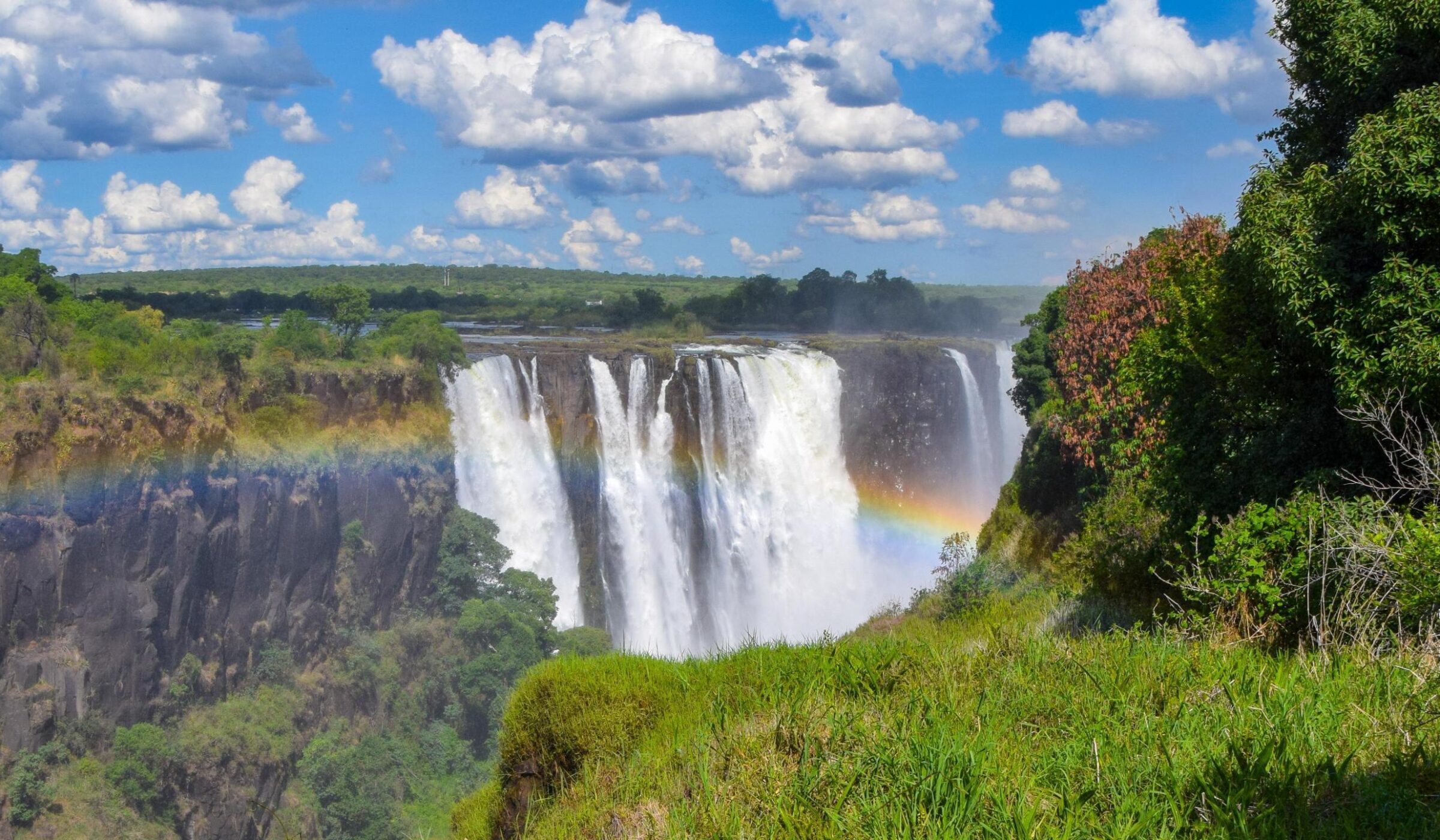 A rainbow appearing over Victoria Falls in Zimbabwe