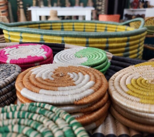 Brightly coloured woven baskets in a Kigali market