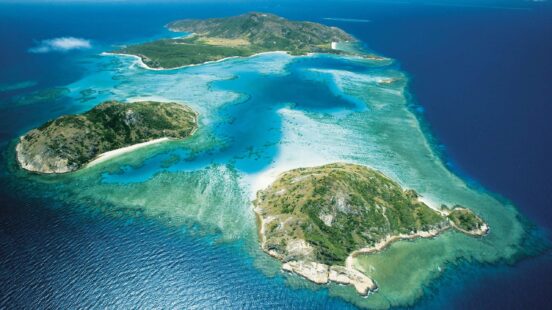 Aerial view of Lizard Island’s secluded reefs and clear waters on the Great Barrier Reef – Australia.