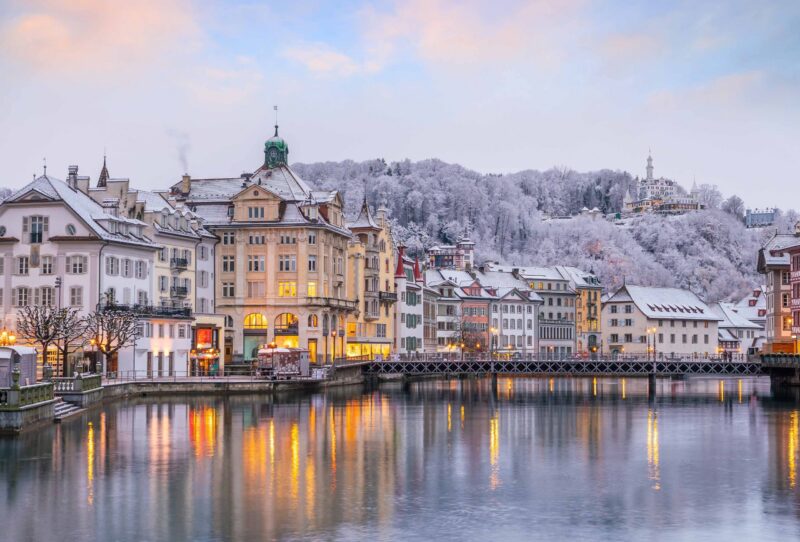 Historic city center of downtown Lucerne with Chapel Bridge and lake Lucerne in Switzerland at sunset