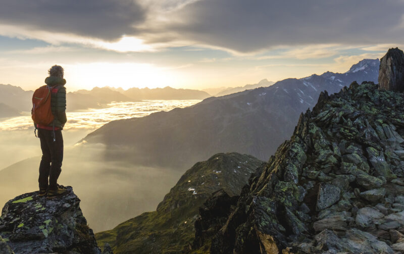 Hiker on mountains panorama view
