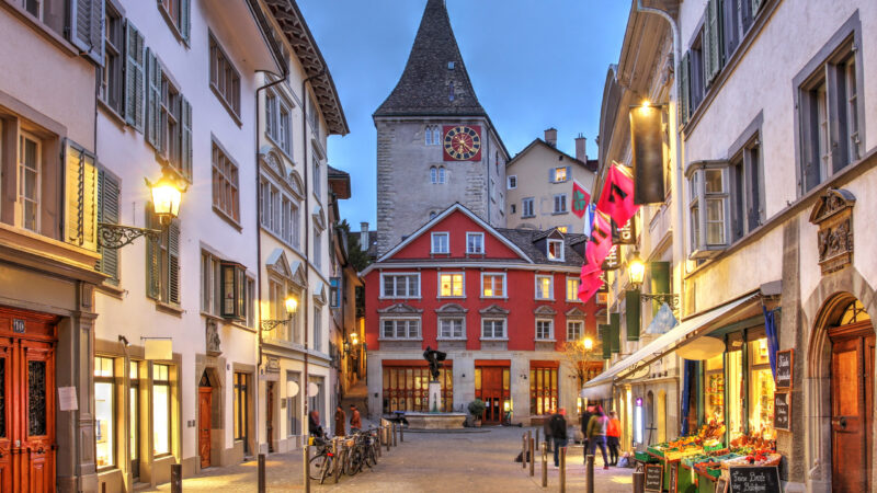 Night scene along the Seilergraben street in the Neumarkt district of the old town (Altstadt) of Zürich, Switzerland. Grimmenturm, dominating the scene, is a medieval residential tower dating back to 1280 and today houses a famous restaurant.