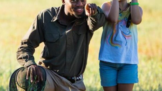 A child on a walking safari at Duba Plains Camp