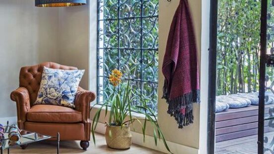 A sitting room leading to garden at Casa Legado in Bogotá, Colombia
