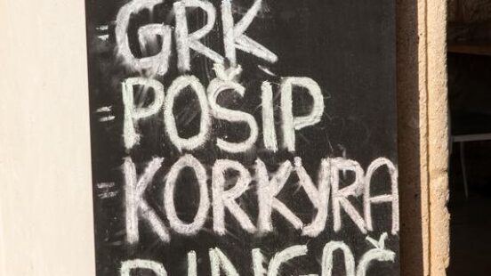 A chalkboard menu titled Wine List featuring handwritten names of various wines including Grk and Dingac.